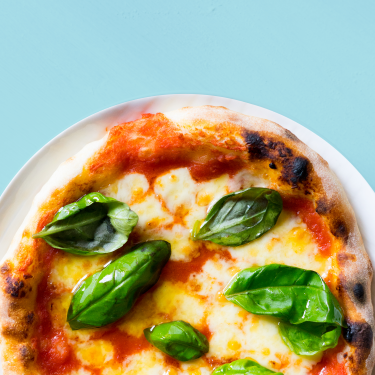 Pizza with basil and chees